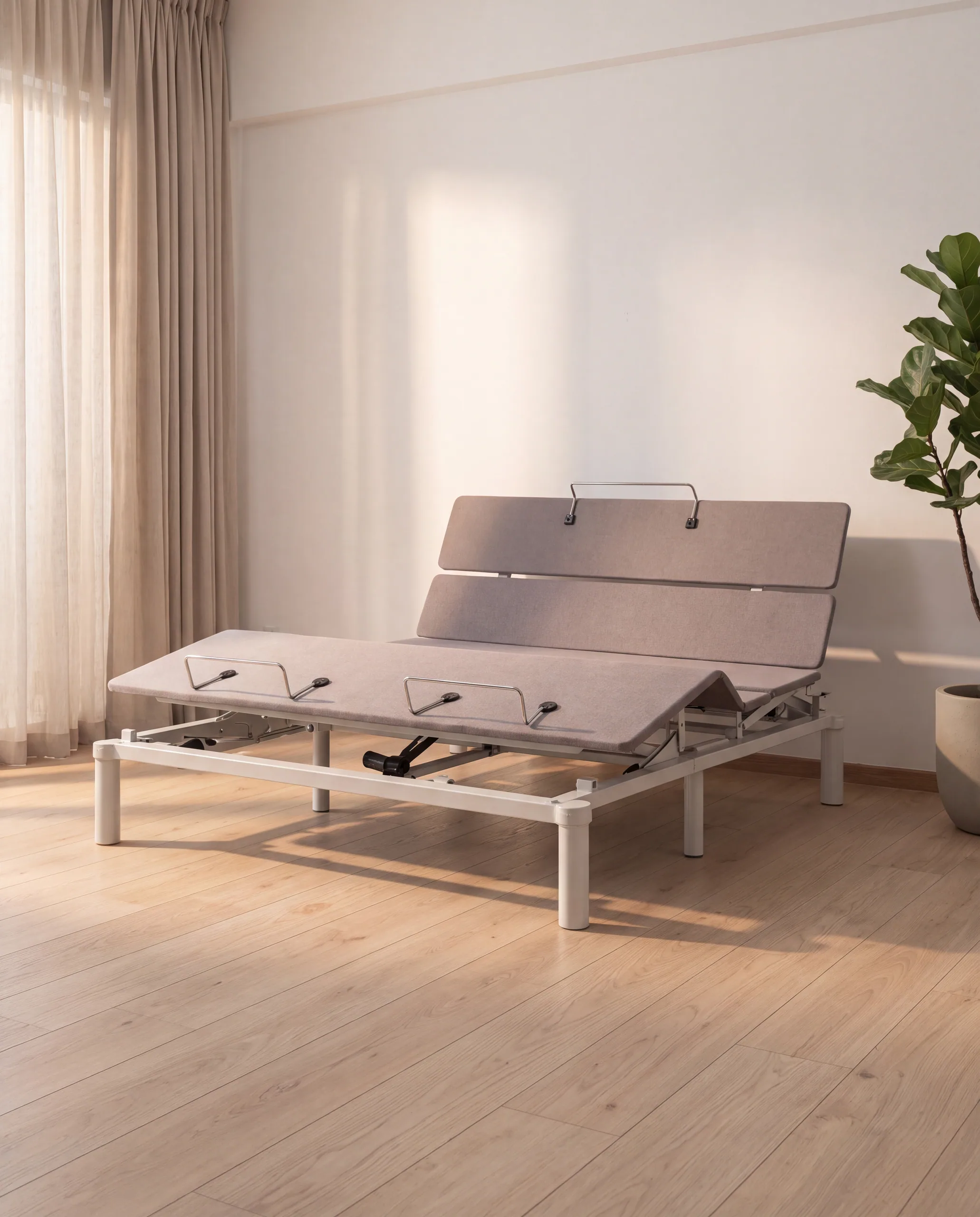 The Elevate Pro adjustable base with the head section raised, no mattress.